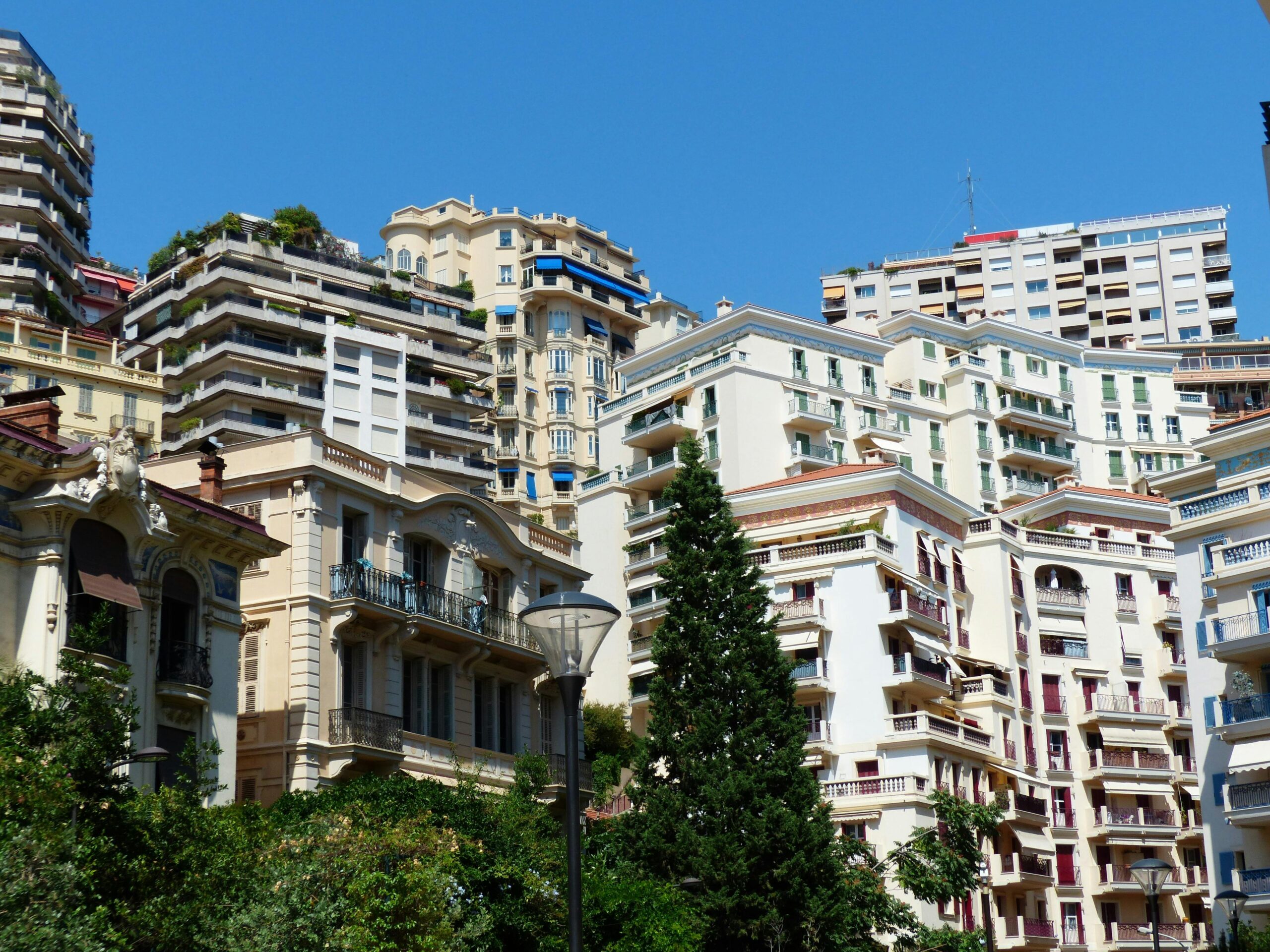 A scenic view of Monaco's luxurious residential architecture under a clear blue sky.