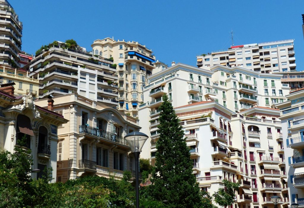 A scenic view of Monaco's luxurious residential architecture under a clear blue sky.